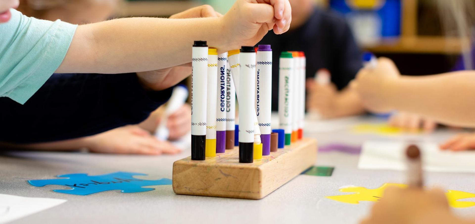 Children using markers.